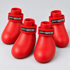 Four red ZippyPaws dog boots